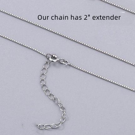 a silver chain with a clasp and a text overlay indicating that the chain has a 2-inch extender.