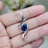 Bow Tanzanite Necklace - 18KGP Sterling Silver - 2 CT Round Blue Tanzanite Pendant - Swirl Knot Style - December Birthstone #557