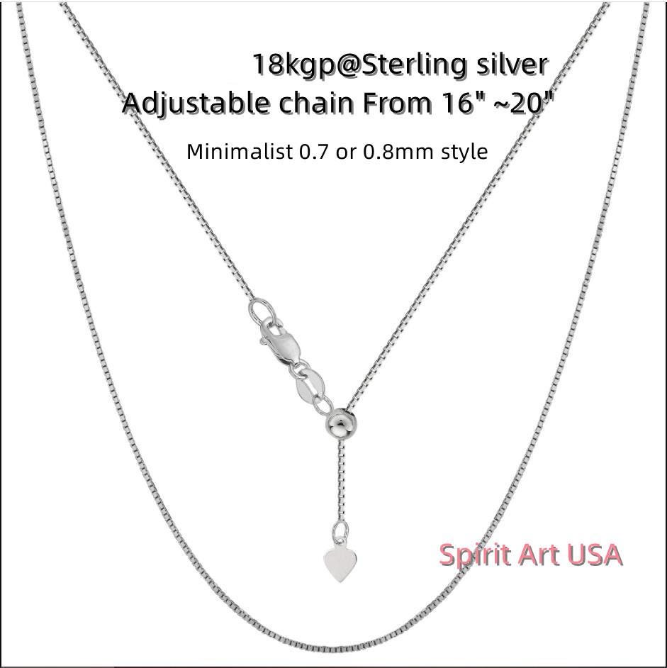 a silver chain with a heart on it