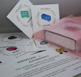 a close up of a pink object on a table