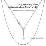 a silver chain with a heart on it