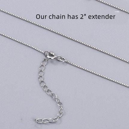 a silver chain with a clasp and a text overlay indicating that the chain has a 2-inch extender.