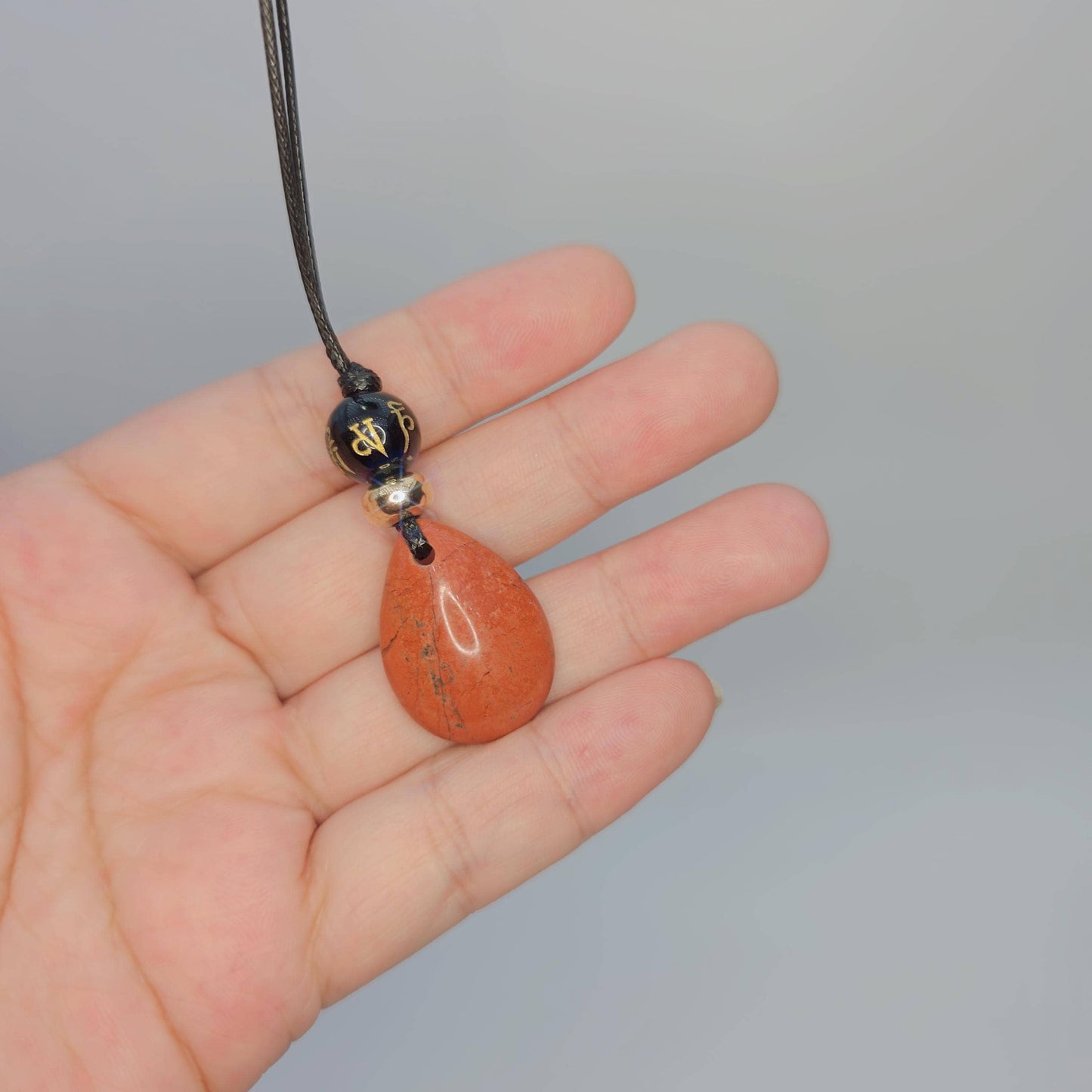 Red jasper black onyx necklace The Six-Syllable Mantra Pendant prayer jewelry adjustble cord up to 24 inches.